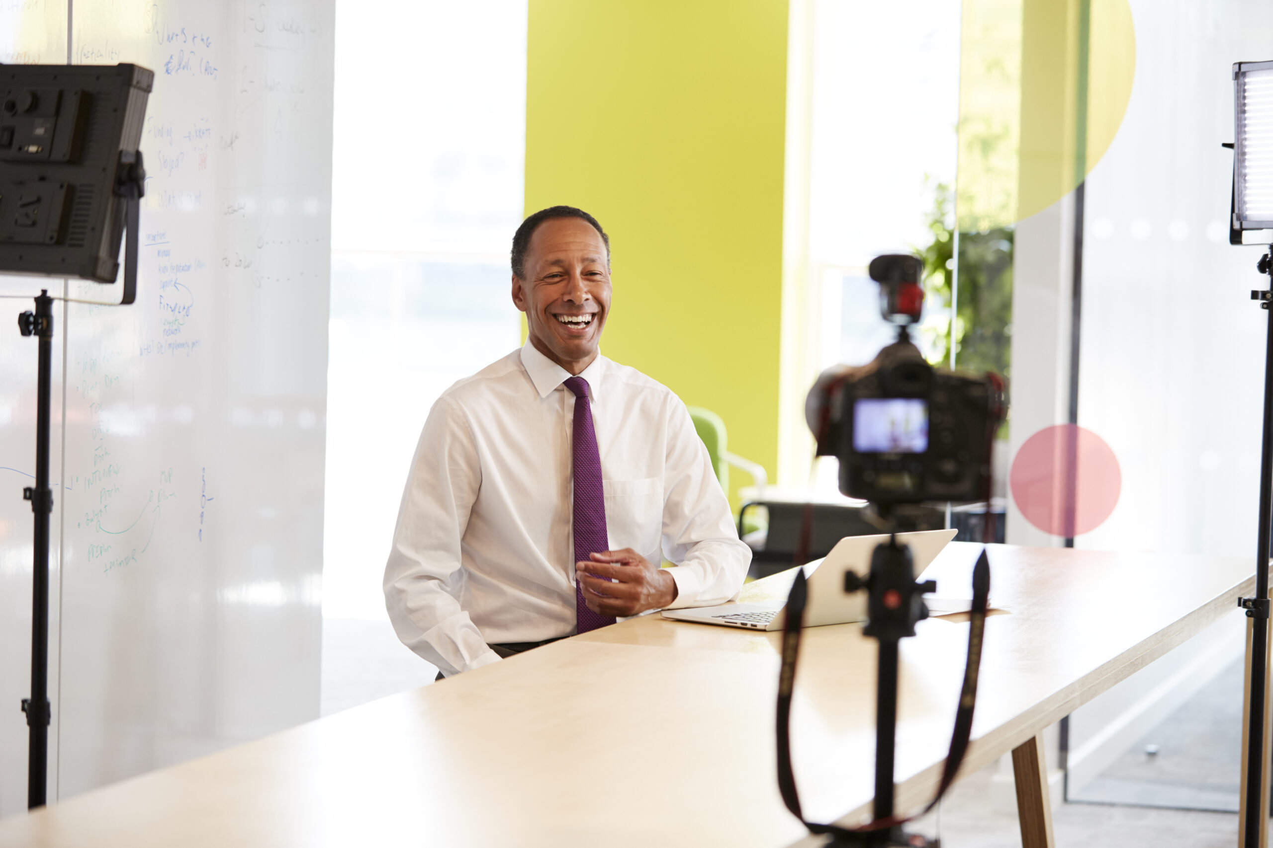 Middle aged businessman making a corporate video