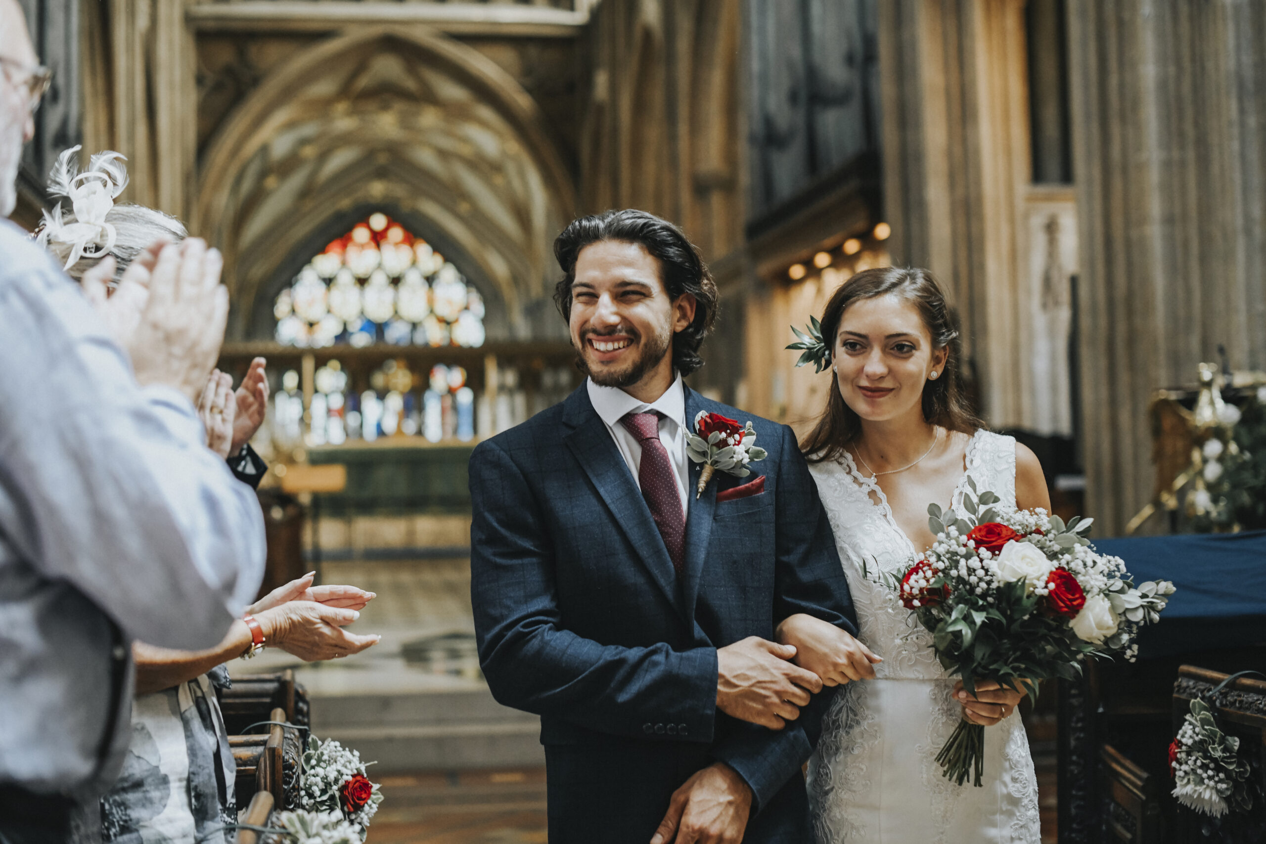Newly wed couple walking down the aisle